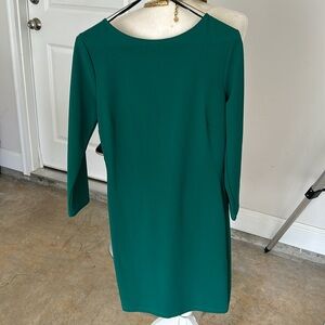 The dress is Symphony size, M Stretch👑. The gold chain accent in the back, ❤️